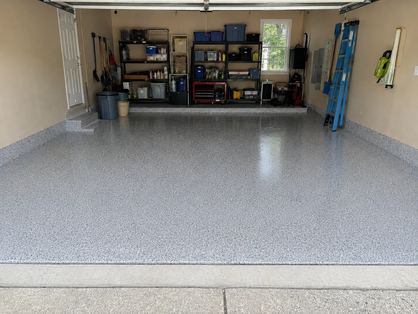 The same garage with a finished light grey flake epoxy floor