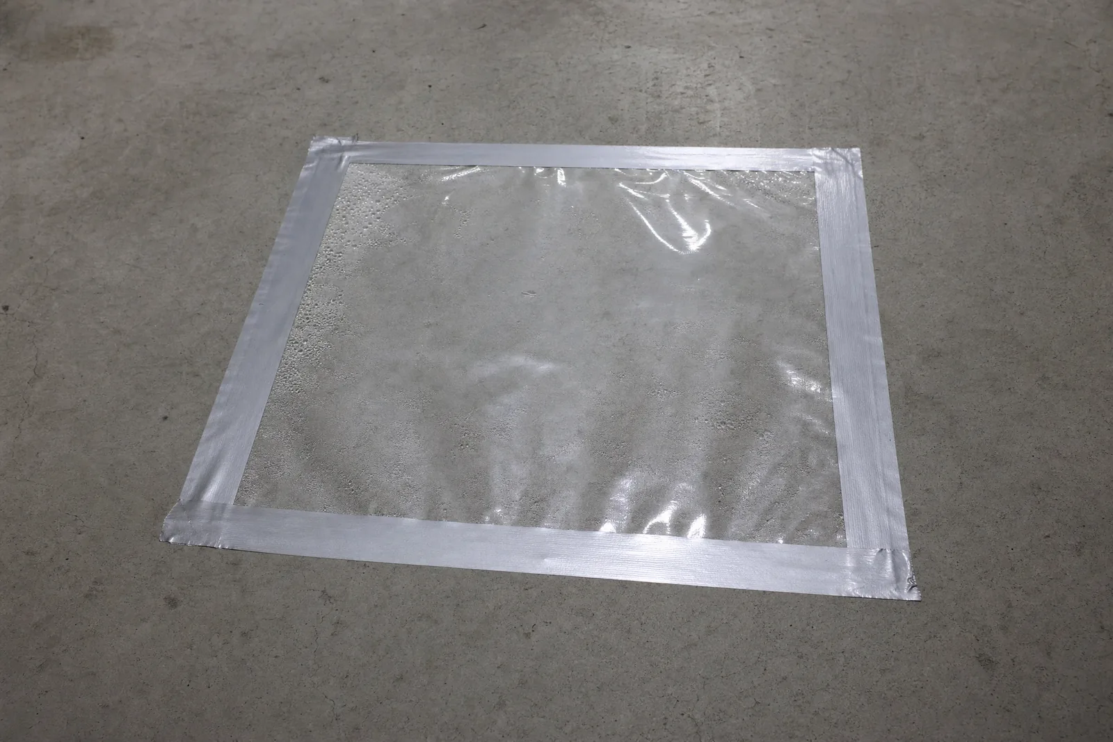 Illustrative moisture testing setup on a concrete slab before coating